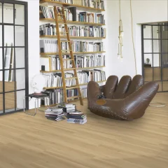 Parador Taterra Charisma Oak composite flooring in sandy beige (1751626) in an interior featuring a bookcase